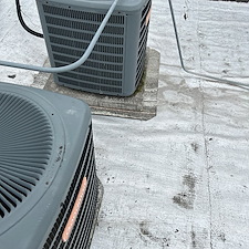 Chicago-Low-Slope-Roof-Repair-Installing-Protective-Membrane-Under-HVAC-Condensers 0