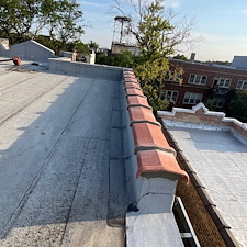 Cracked-or-Broken-Clay-Tile-on-Your-Flat-Roof-Expert-Repairs-in-Chicago 1