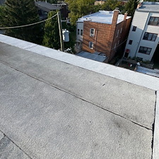 Edge-Flashing-Repairs-for-Flat-Roofs-in-Chicago-Membrane-Pulling-Away 1