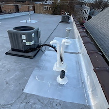 Fix-Damaged-Rubber-Portals-Around-Line-Sets-on-a-Flat-Roof-in-Glenview 2