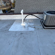 Fix-Damaged-Rubber-Portals-Around-Line-Sets-on-a-Flat-Roof-in-Glenview 3