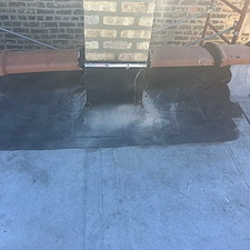 Flat-Roof-Leak-Around-Chimney-in-Chicago-Unsealed-Membrane-Could-Be-the-Cause 2