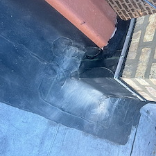 Flat-Roof-Leak-Around-Chimney-in-Chicago-Unsealed-Membrane-Could-Be-the-Cause 3