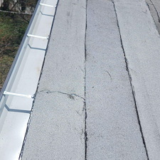 Flat-Roof-Leak-Solutions-Fixing-Loose-Membranes-Along-the-Gutter 0