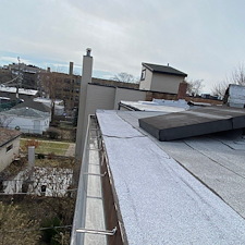 Flat-Roof-Leak-Solutions-Fixing-Loose-Membranes-Along-the-Gutter 3