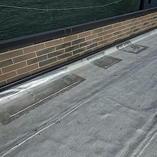 Flat-Roof-Leaking-in-Chicago-Water-Trapped-Under-Membrane-Anchor-Point-Roofing-Can-Help 0