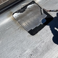 Flat-Roof-Leaking-in-Chicago-Water-Trapped-Under-Membrane-Anchor-Point-Roofing-Can-Help 3