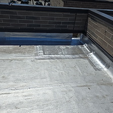 Flat-Roof-Leaking-in-Chicago-Water-Trapped-Under-Membrane-Anchor-Point-Roofing-Can-Help 1