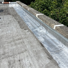 Flat-Roof-Leaks-in-Chicago-Address-Loose-Membrane-Issues-on-Wall-Flashing-Today 0