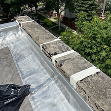 Flat-Roof-Leaks-in-Chicago-Address-Loose-Membrane-Issues-on-Wall-Flashing-Today 1