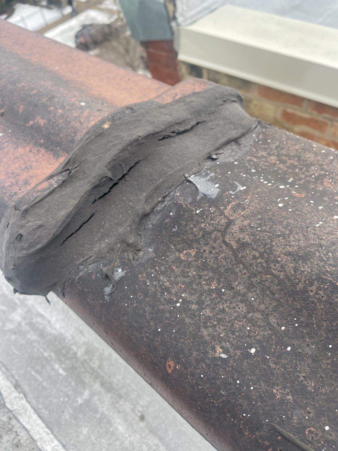 Gaps in Clay Coping on a Flat Roof in Chicago