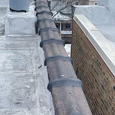 Gaps-in-Clay-Coping-on-a-Flat-Roof-in-Chicago 3