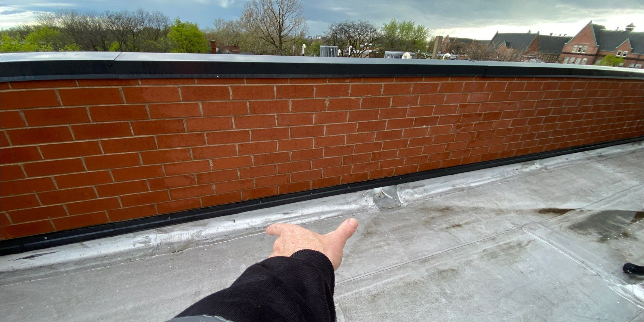 How to Address Water Trapped Under the Membrane on a Flat Roof