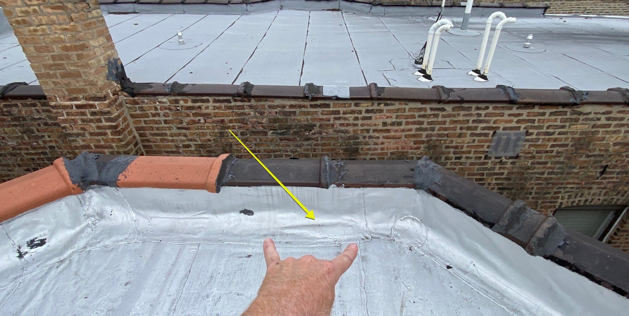 How to Fix Water Trapped Under Flat Roof Membrane in Chicago