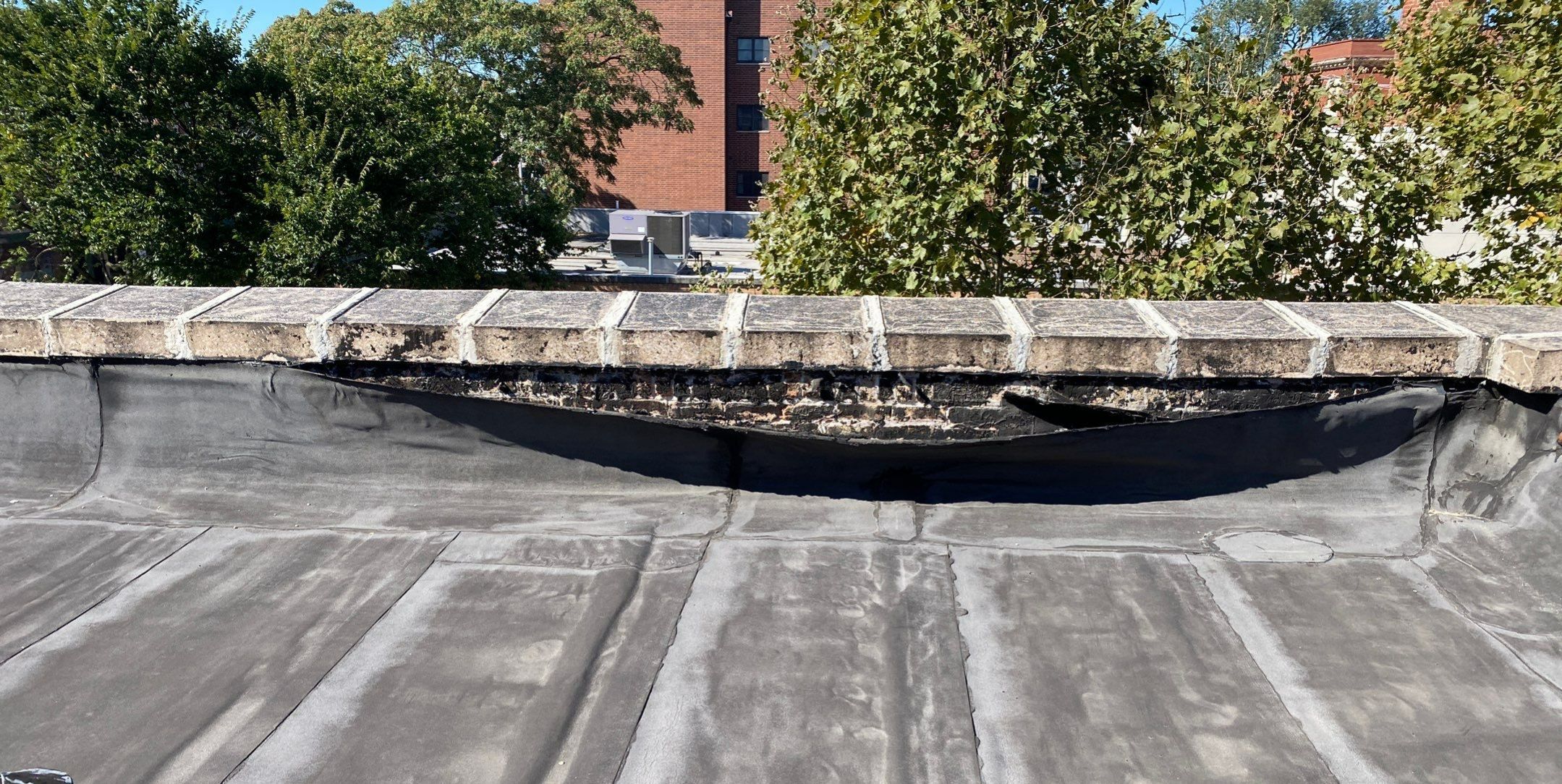 Is Your Flat Roof Leaking? How Membrane Pulling Away Can Cause Water Damage