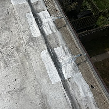 Loose-Gutter-Straps-on-Flat-Roof-in-Chicago-Lets-Secure-and-Repair-Them 2