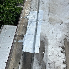 Loose-Gutter-Straps-on-Flat-Roof-in-Chicago-Lets-Secure-and-Repair-Them 0