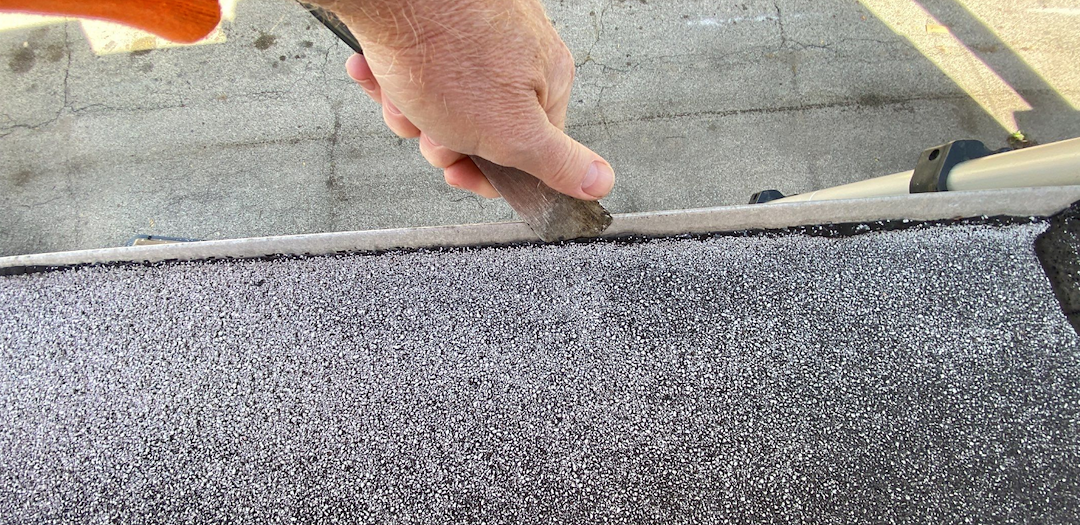 Low Slope Roof Repair: Fixing Membrane Pulling Away from Gravel Stop | Anchor Point Roofing