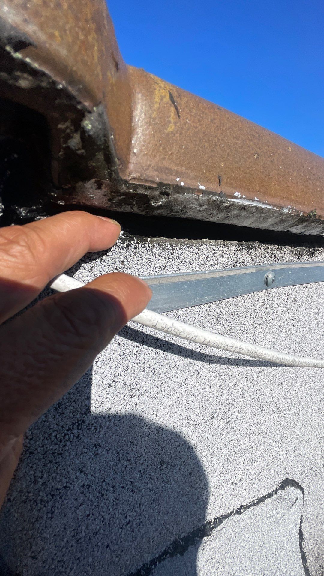 Low Slope Roof Repair: Fixing Wall Flashing Openings for Lasting Protection