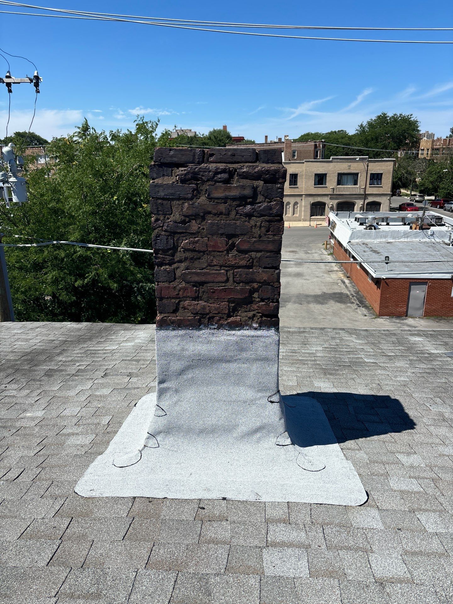 Reliable Roof Repairs: Heat-Welded Modified Bitumen Membrane Around Chimney