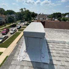 Reliable-Roof-Repairs-Heat-Welded-Modified-Bitumen-Membrane-Around-Chimney 0